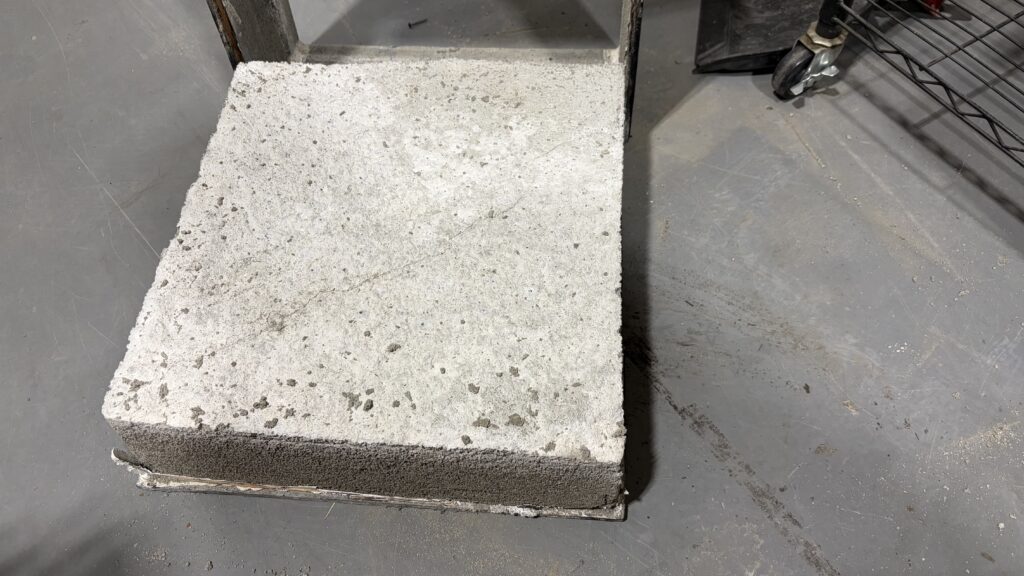 CLSM or regolith-analog material block used for excavation and surface-system testing