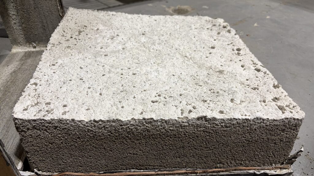 CLSM or regolith-analog material block used for excavation and construction-material work