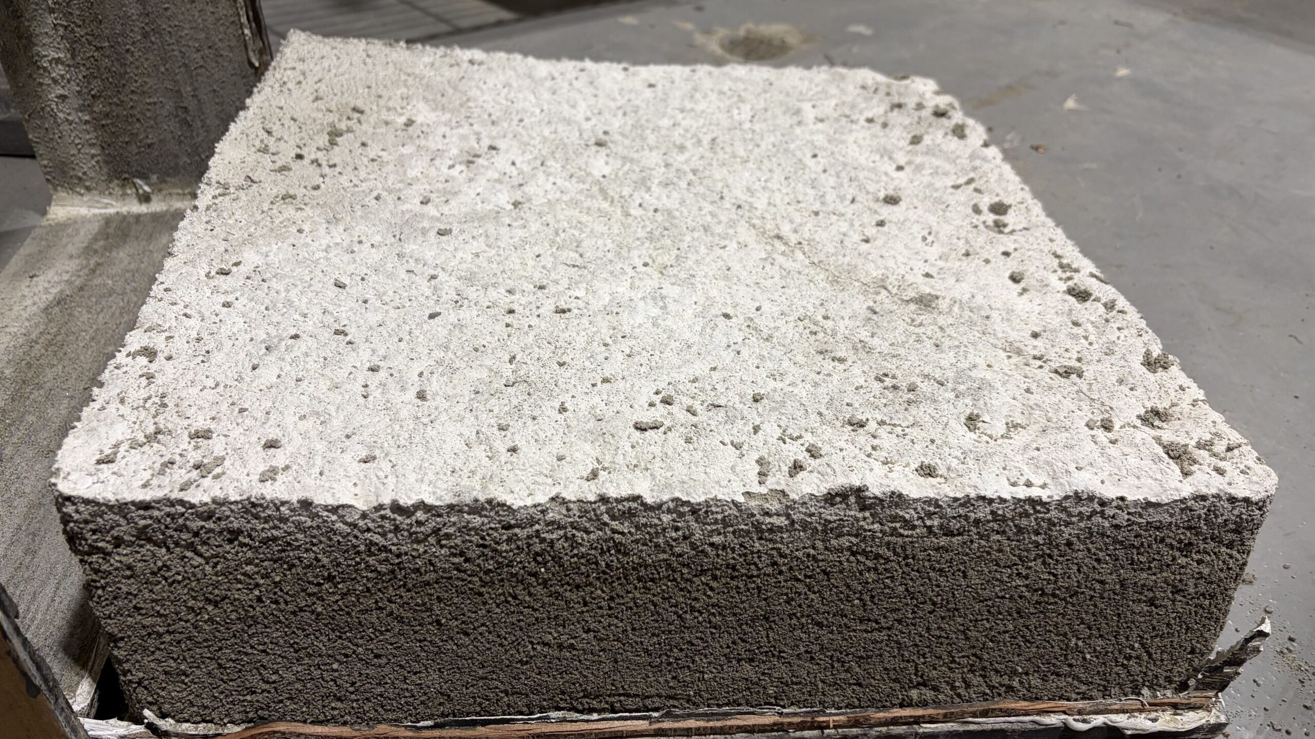 CLSM or regolith-analog material block used for excavation and construction-material work