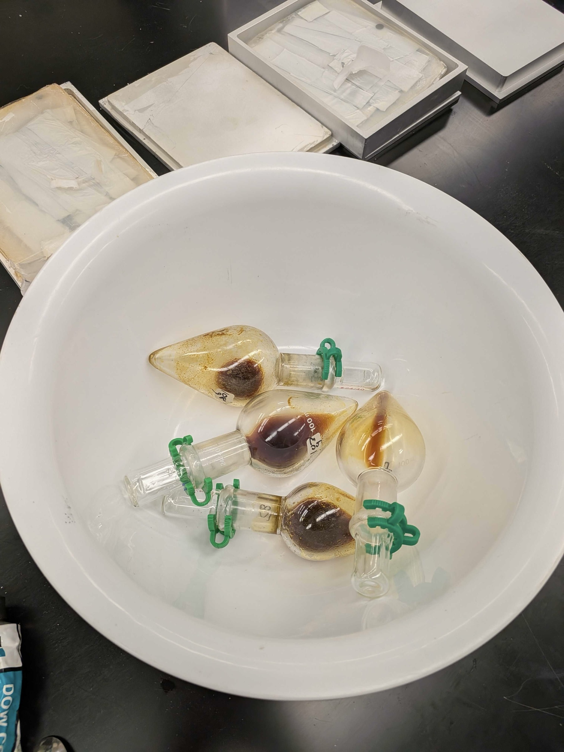 Small glass vessels contain representative material samples collected during Cislune's LunaRecycle finals campaign.